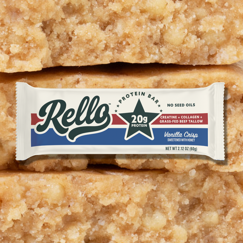 Front view of Vanilla Crisp protein bar package showing 20g protein star label with vanilla bar texture enlarged in the background