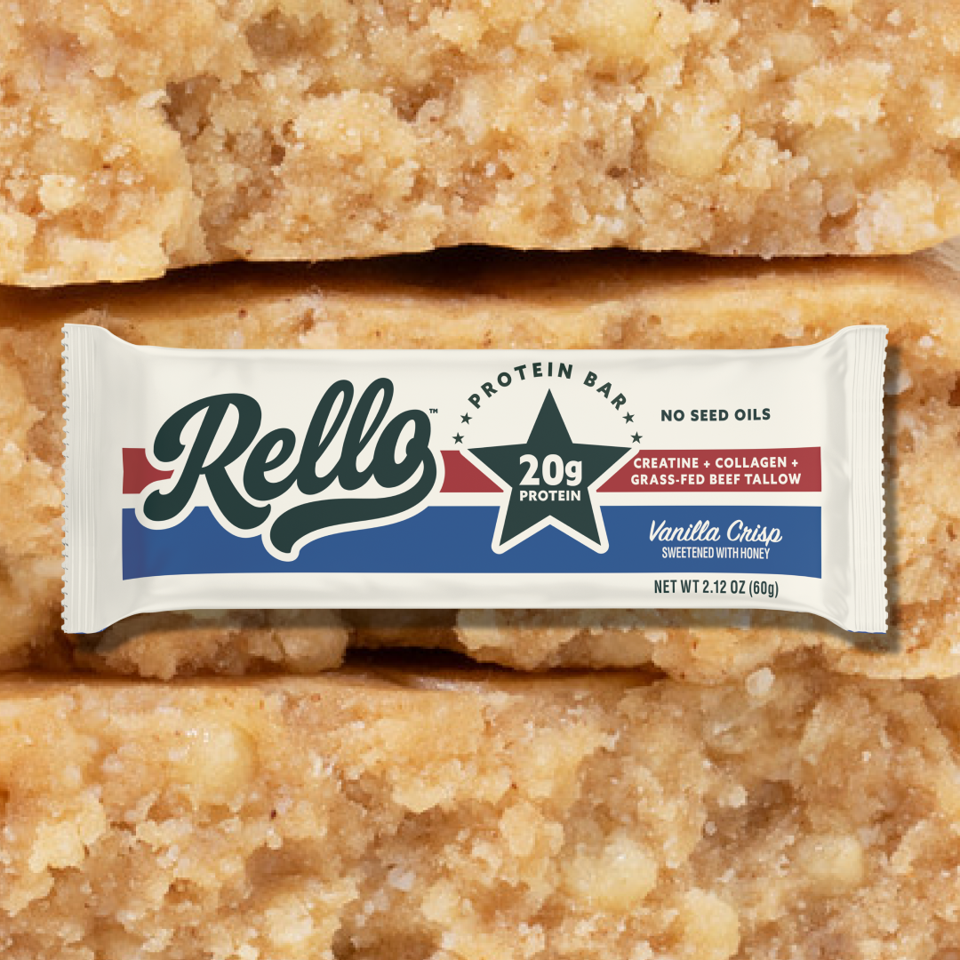 Front view of Vanilla Crisp protein bar package showing 20g protein star label with vanilla bar texture enlarged in the background