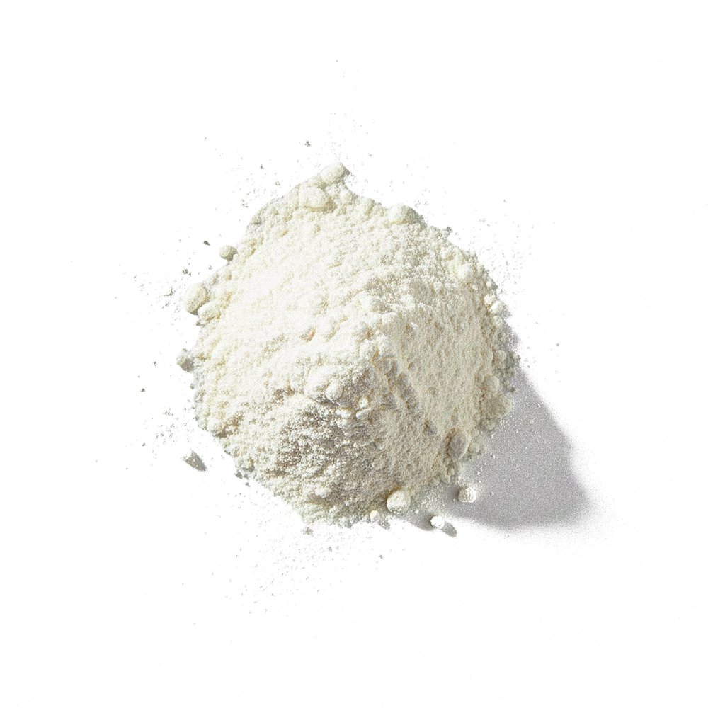 Top-down view of grass-fed protein powder pile showcasing fine off-white powder texture on black background